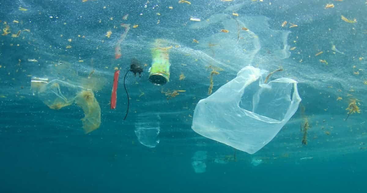 Plastic waste floating in ocean water